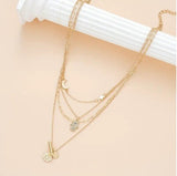 Multi-Strand Golden Tone Charms with Rhinestones Eye Star Moon and Disc Pendant