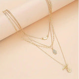 Multi-Strand Golden Tone Charms with Rhinestones Eye Star Moon and Disc Pendant